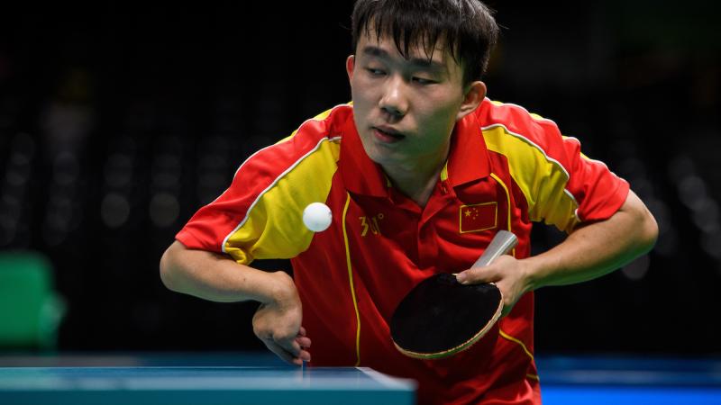 a Para table tennis player goes for a shot