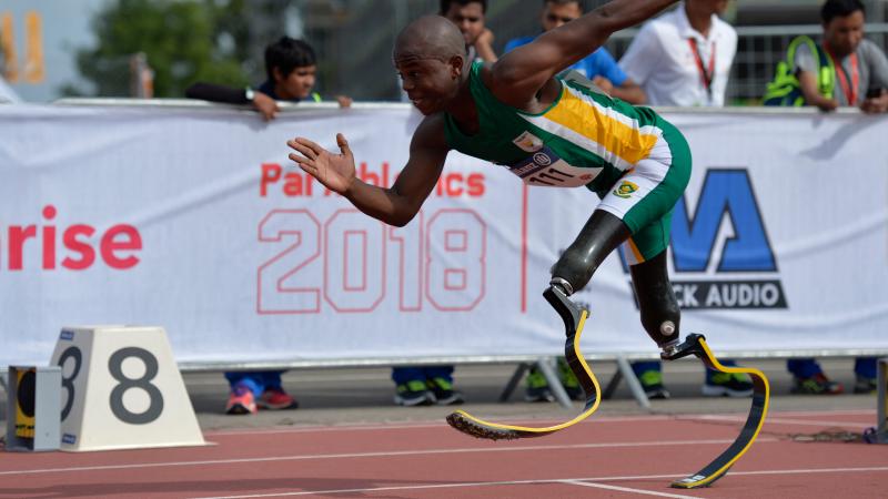 a male T44 sprinter starts from the blocks