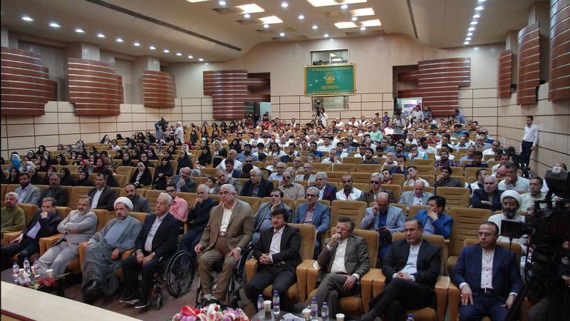 a group of Para athletes seated in an auditorium