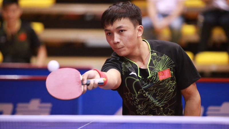 A Para table tennis player takes a shot