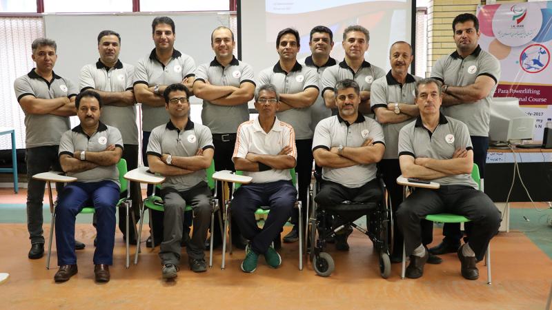 a group of officials pose for a photo