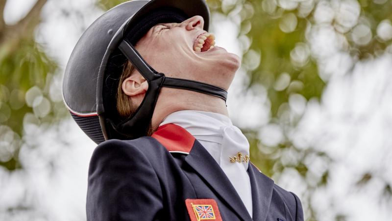 a Para equestrian rider laughing