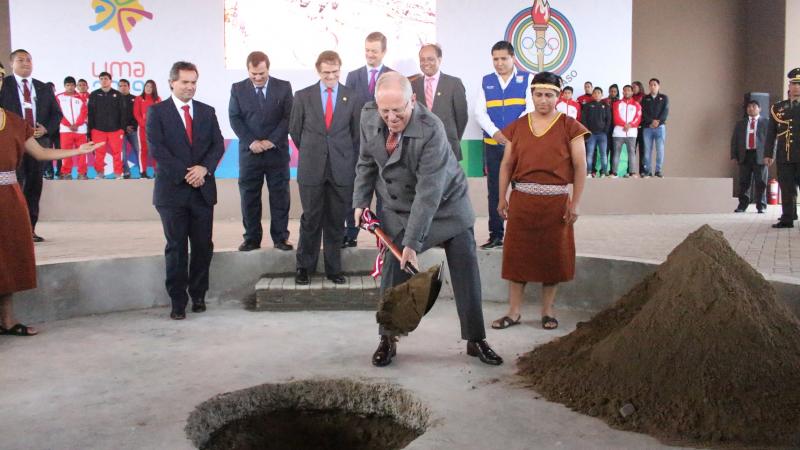 a man digs a hole in the ground