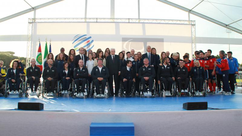 a group of people smile for the camera