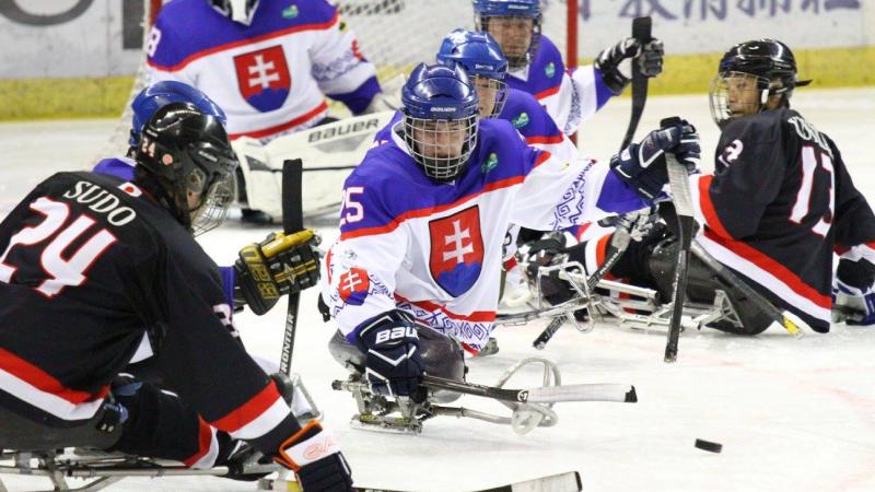 a group of Para ice hockey players on the ice