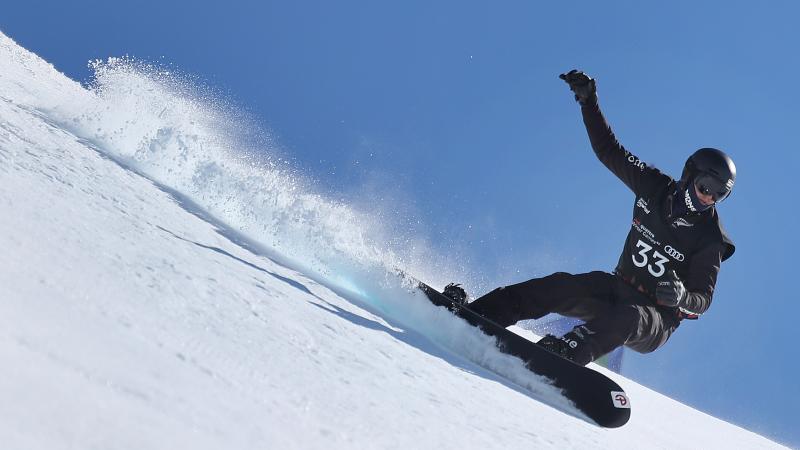 a male Para snowboarder