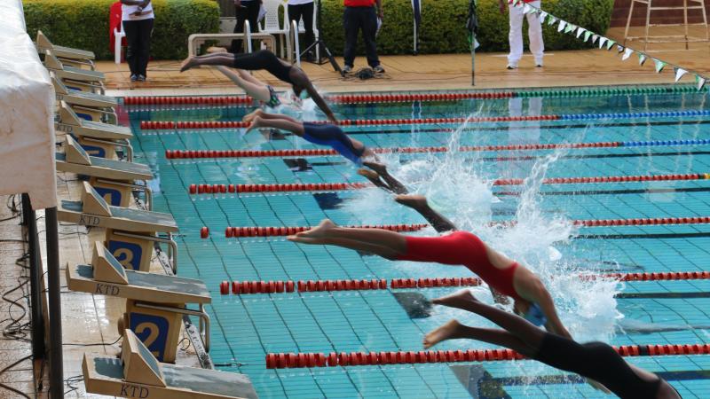 Kenya swimming champs a group of Para swimmers dive into a pool
