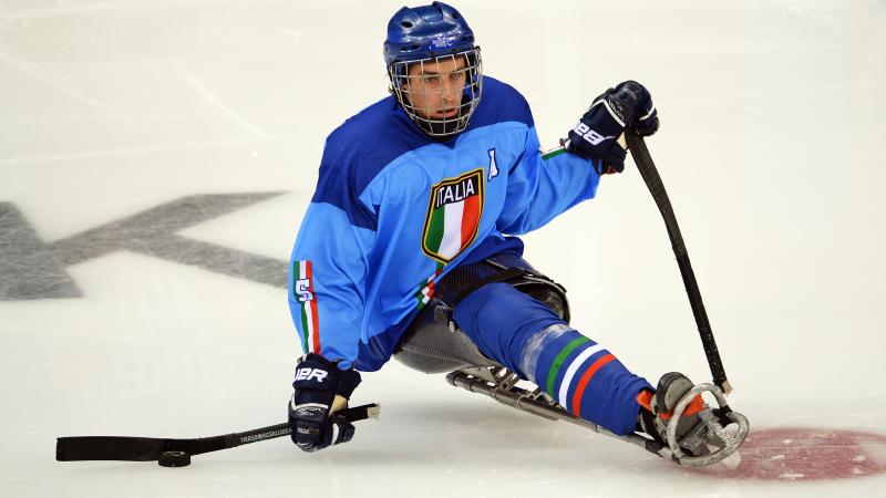 a male Para ice hockey player on the ice