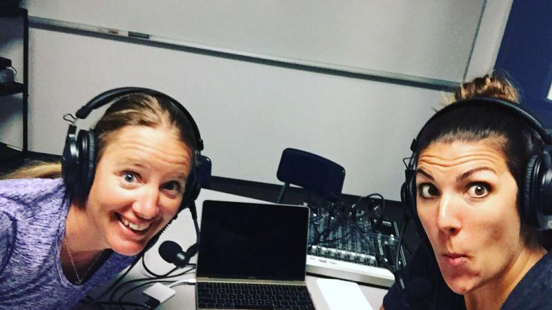 two women take a selfie in a studio