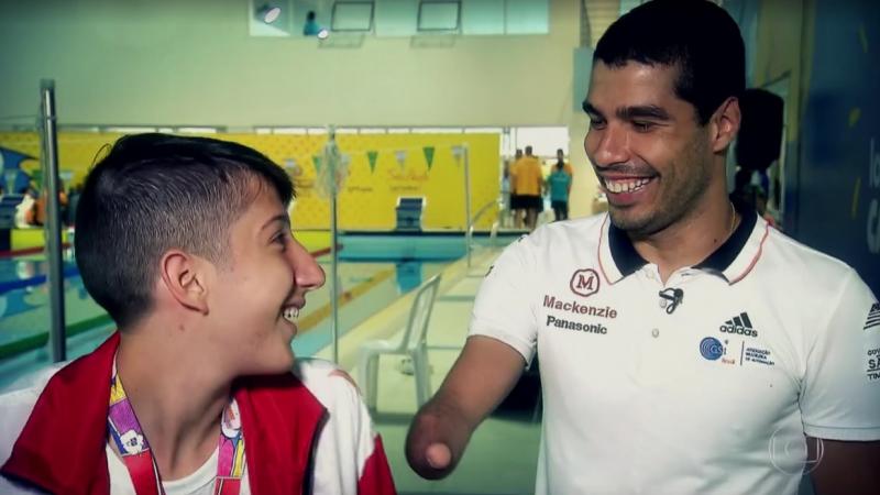 Man and a teenage boy smiling