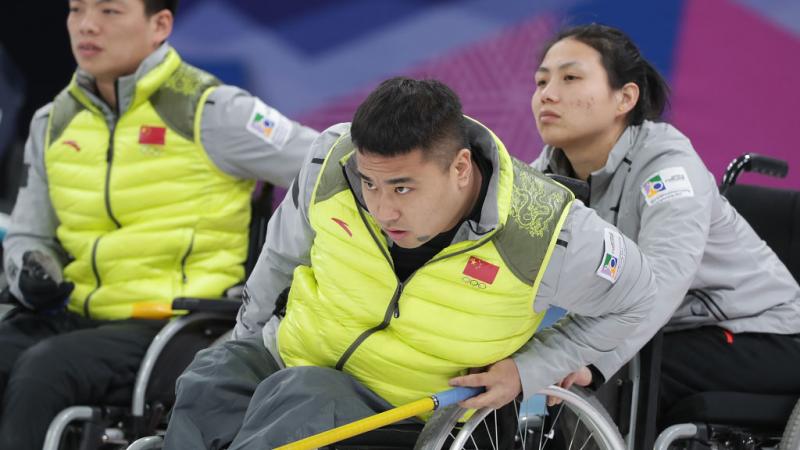 a male wheelchair curling player