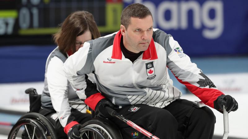 a male wheelchair curling player