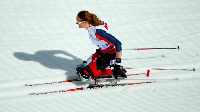 a female Para Nordic skier on the snow