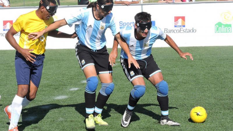 Argentina beat Brazil at the 2017 IBSA Blind Football American Championships Men fighting for a football
