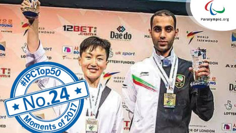 a female Para taekwondo fighter raises her trophy and smiles