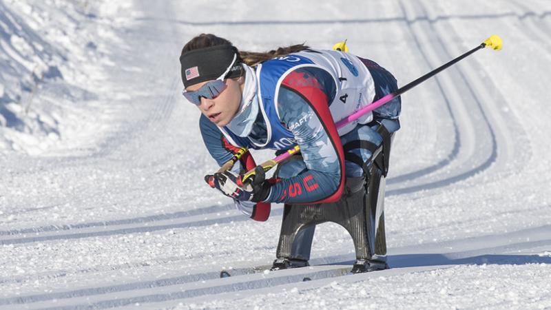 Oksana Masters skiing on a sit-ski