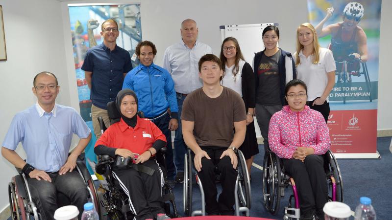 Seven new Proud Paralympian leaders pose with the workshop educators in Dubai