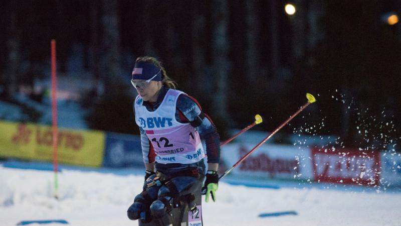 a female sit skier on the snow