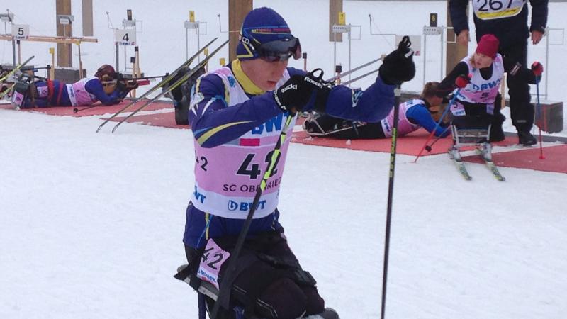 Athlete on a sit skiing racing