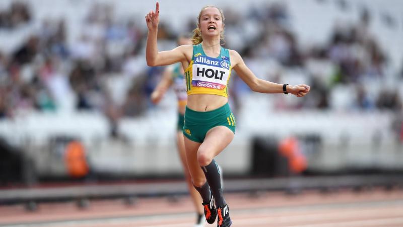 Isis Holt of Australia a female Para sprinter crosses the line to win the race