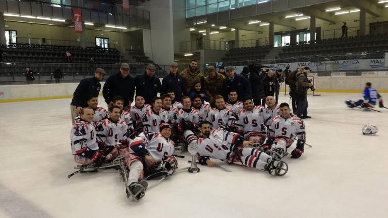 a Para ice hockey team sitting on the ice