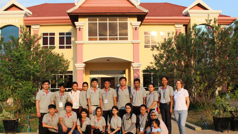 Members of NPC Cambodia and Agitos Foundation staff pose for picture in front of NPC headquarters in Phnom Penh