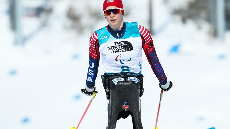 a female Para Nordic skier in the snow