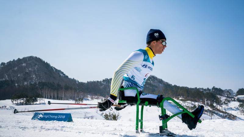 a male Nordic sit skier