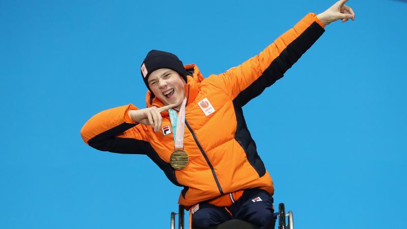 A male alpine skier on the podium