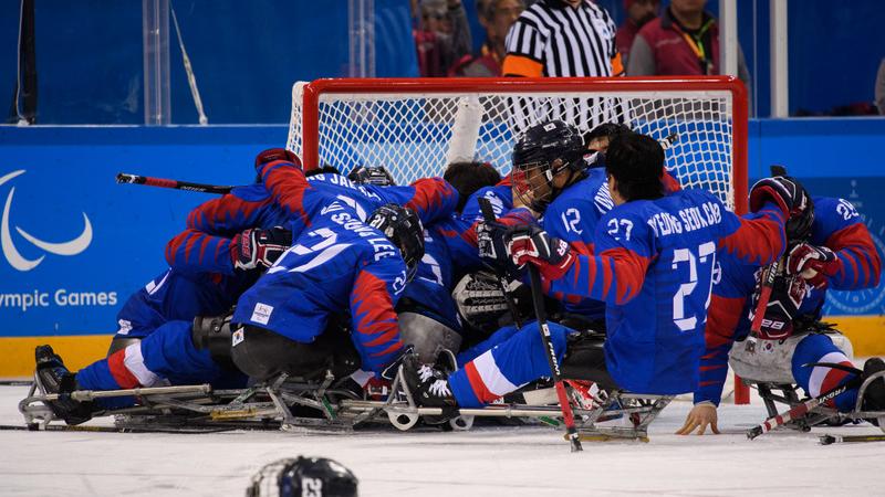 Para ice hockey players celebrating