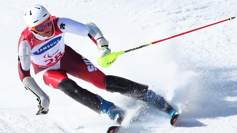 a male Para alpine skier in action