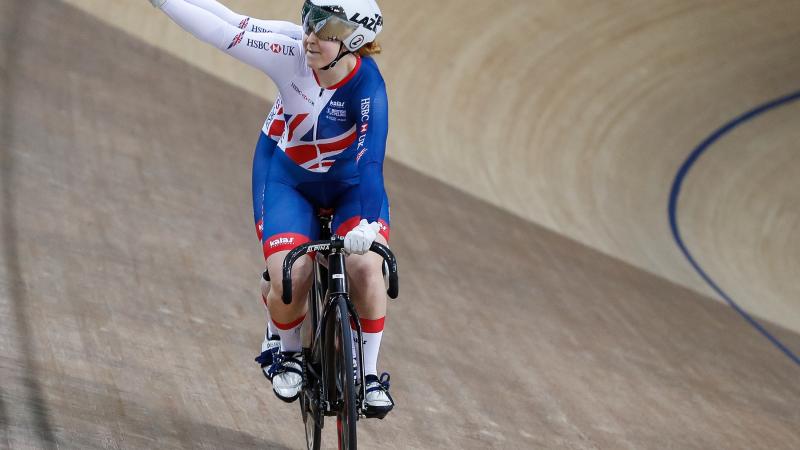 a female tandem team celebrate winning a race