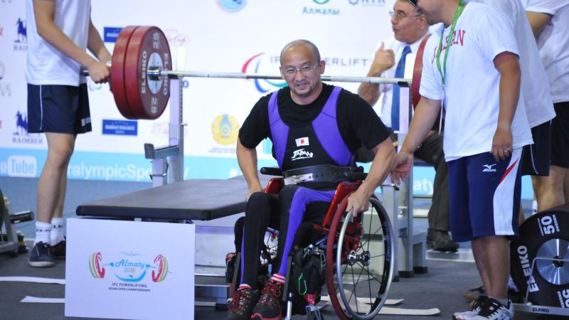 a male powerlifter on the bench