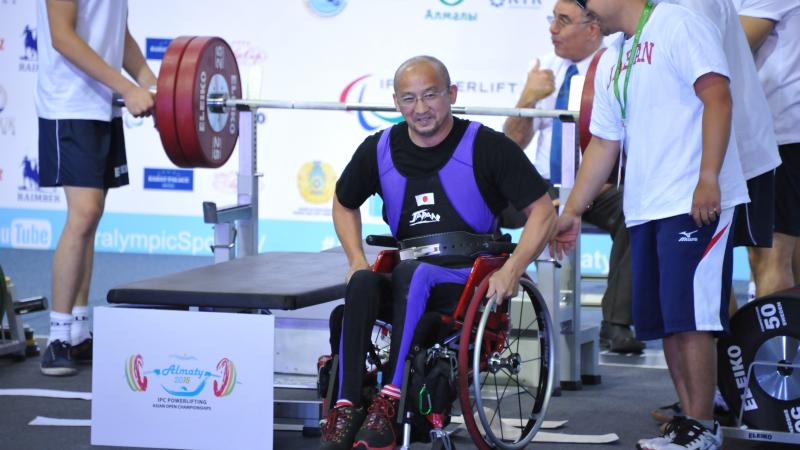 a male powerlifter on the bench