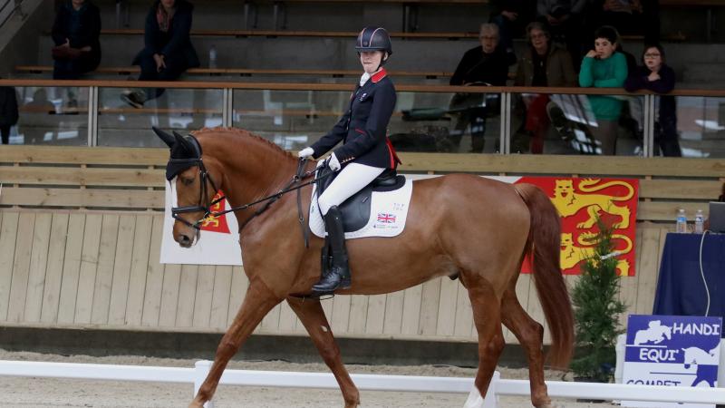 a female Para equestrian rider on her horse