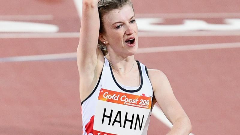 a female Para sprinter punches the air