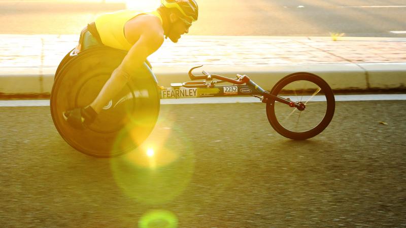 Athlete on wheelchair taking part in race