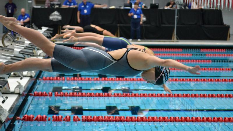 Women swimmers on the starting blocks