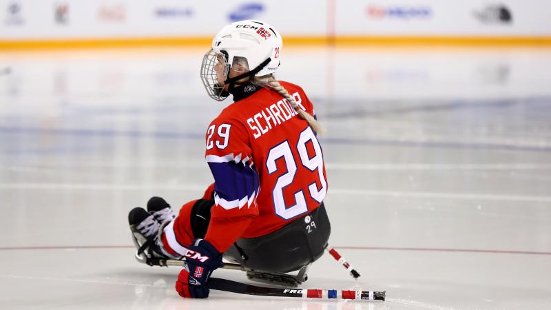 a female Para ice hockey player on the ice