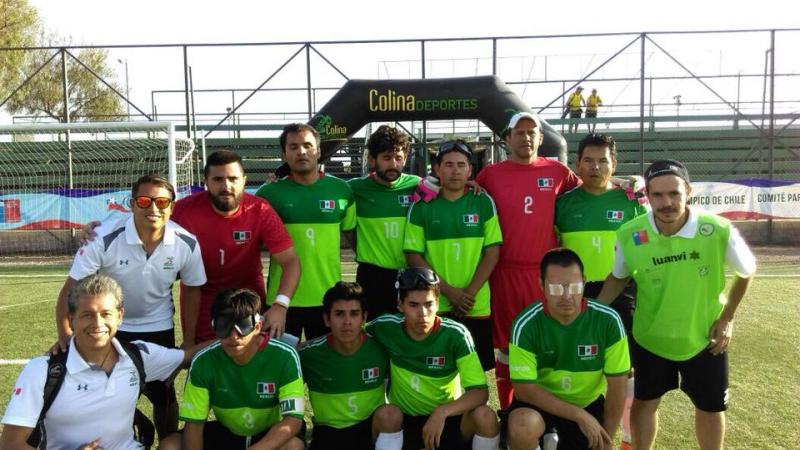 a group of blind footballers pose for a team photo