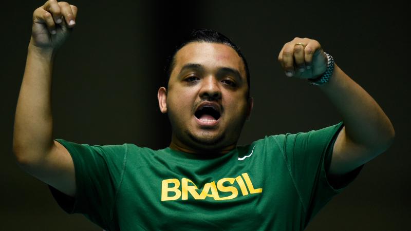 a male boccia player celebrates a throw