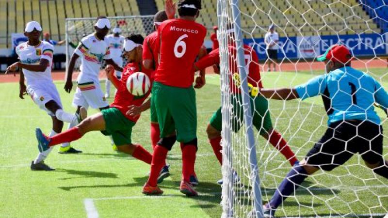 a blind footballer takes a shot