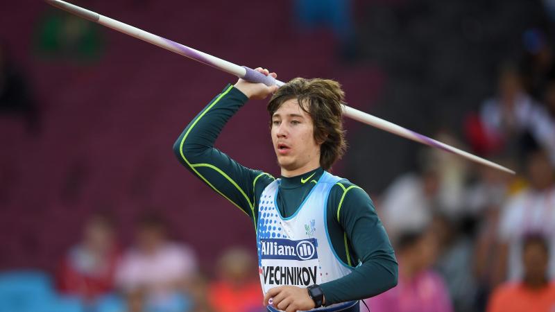 a male Para athlete throwing a javelin