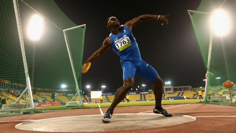 a male discus thrower in action
