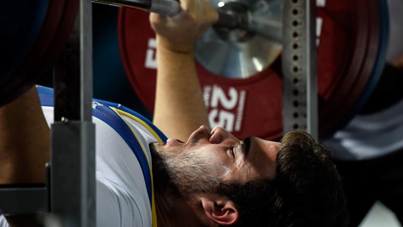 A male powerlifter prepares to lift