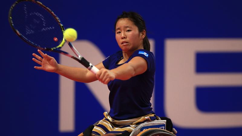 a female wheelchair tennis player