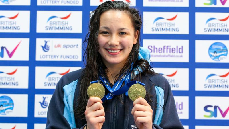 Great Britain's Alice Tai shows her two gold medals at the Sheffield 2018 World Series