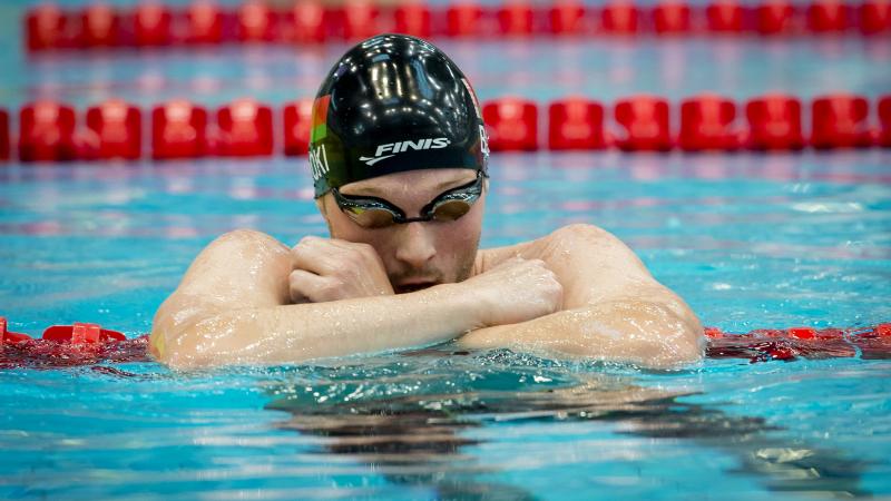 Male swimmer in goggles in the pool