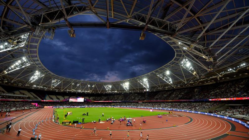 a wide shot of an athletics stadium at night