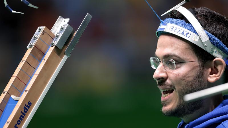 a male boccia player prepares to play a ball